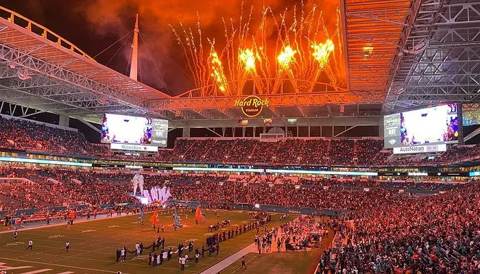 Hard Rock Stadium game night with fireworks over a packed crowd