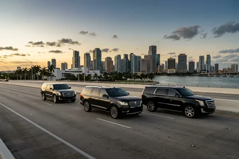 Elegant woman stepping out of a black luxury SUV with shopping bags while a chauffeur holds the door, palm trees and Aventura storefronts in the background