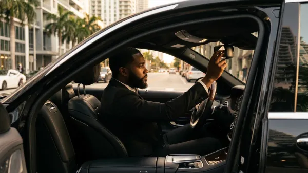 Black car waiting curbside in Wynwood during an hourly as-directed service booking