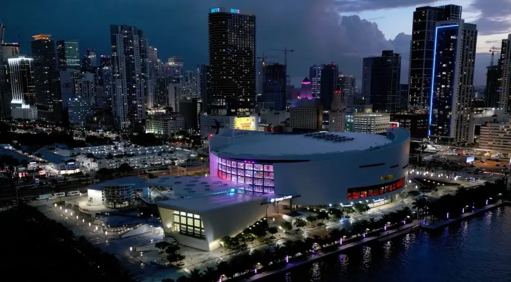 Kaseya Center at night on Biscayne Bay with downtown Miami skyline