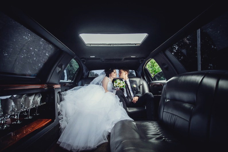 The couple sitting in the limo.