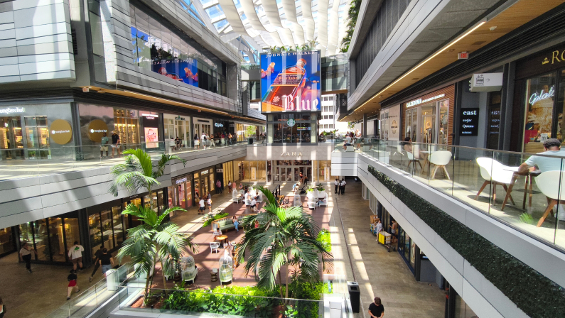 Miami, Florida - July 5, 2024: Brickell City Centre shopping mall in Miami, showcasing modern architecture, shoppers, retail stores, and open spaces.