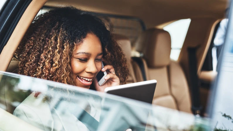 Black woman, car and phone call with tablet for meeting, travel and cellphone for connection. Technology, internet and with chauffeur for female person, backseat and window for taxi service ceo