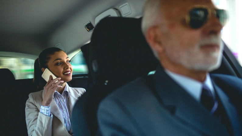 Beautiful business woman is working in car