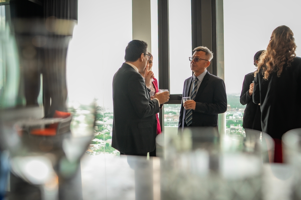 Elegant networking scene at a rooftop hotel party